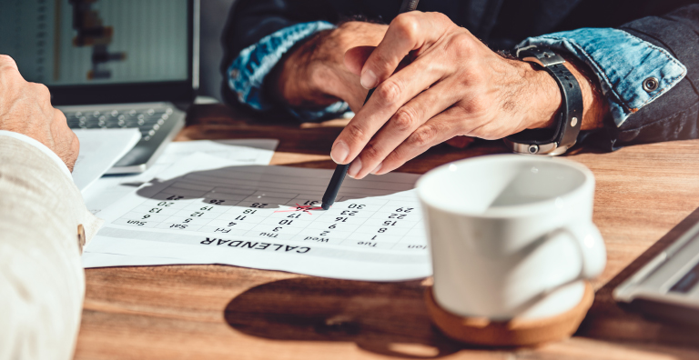 hand crossing off calendar date