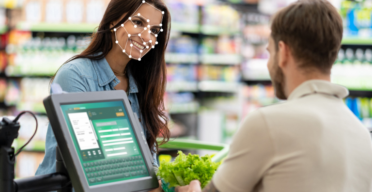 Facial recognition is used across the smiling face of a store customer.