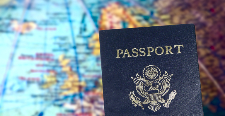US passport in front of globe