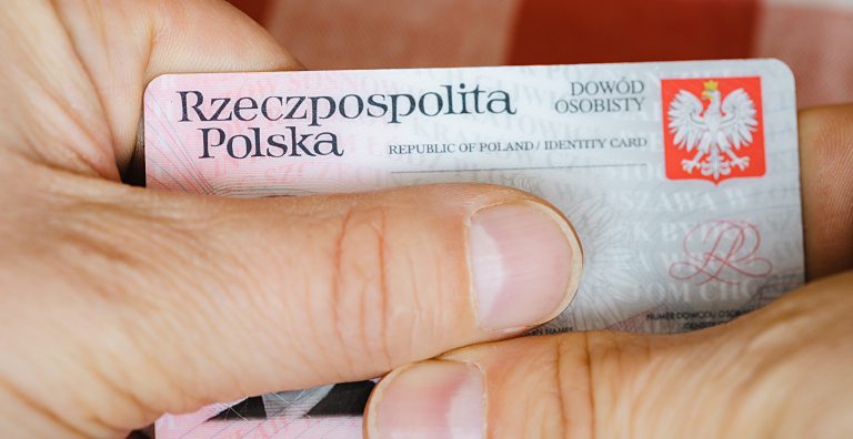 person holding Polish ID card