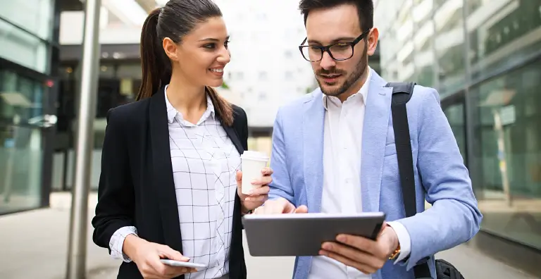two people looking at tablet