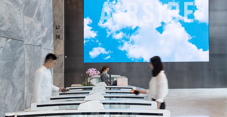 people using turnstile at airport
