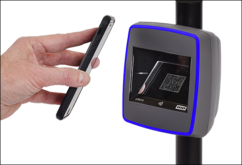hand holding smartphone to ticket reader