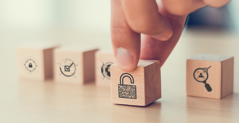 hand putting down wooden block