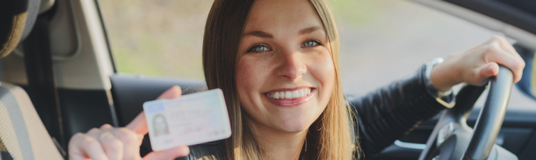 woman showing drivers license